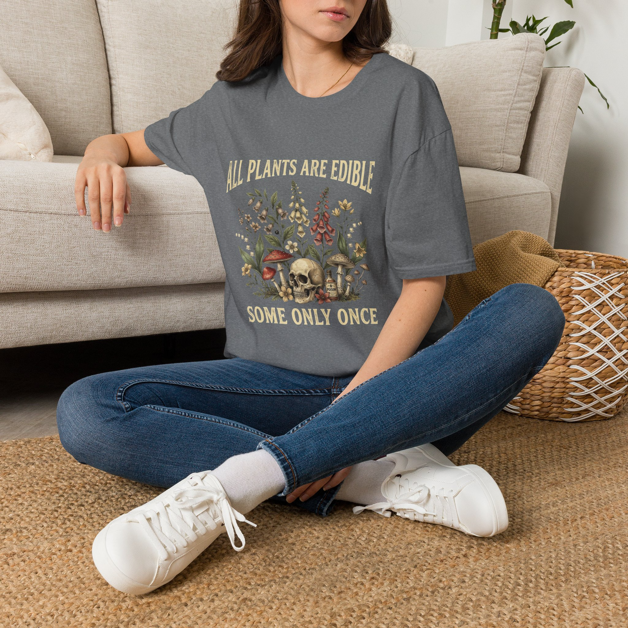 Woman wearing the All Plants Are Edible Some Only Once graphic T-shirt in dark heather